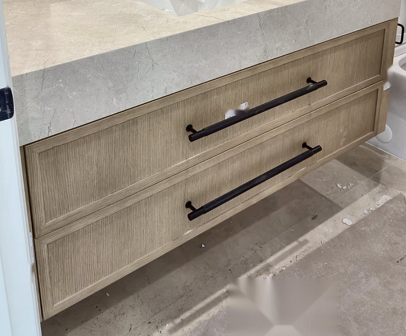 Floating white oak vanity with stone top