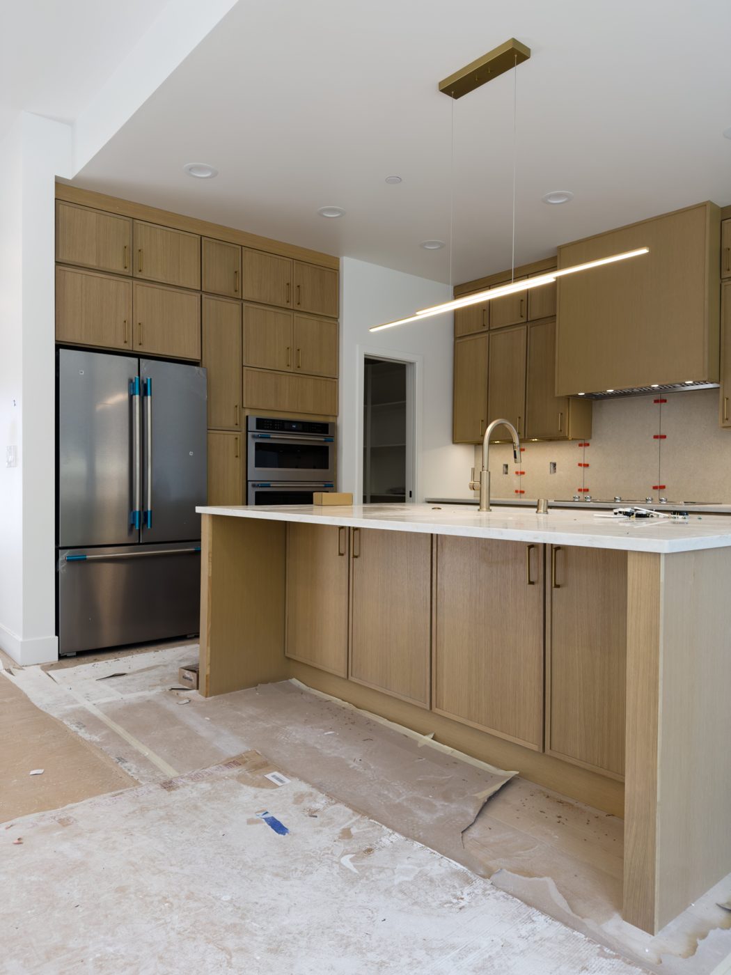 White oak kitchen with ceiling-height uppers